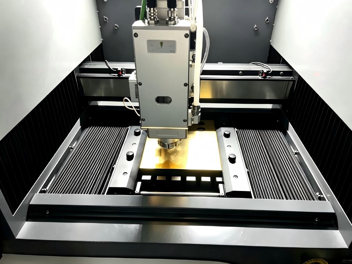 Clamping fixture holding thin gold and silver sheet flat during cutting