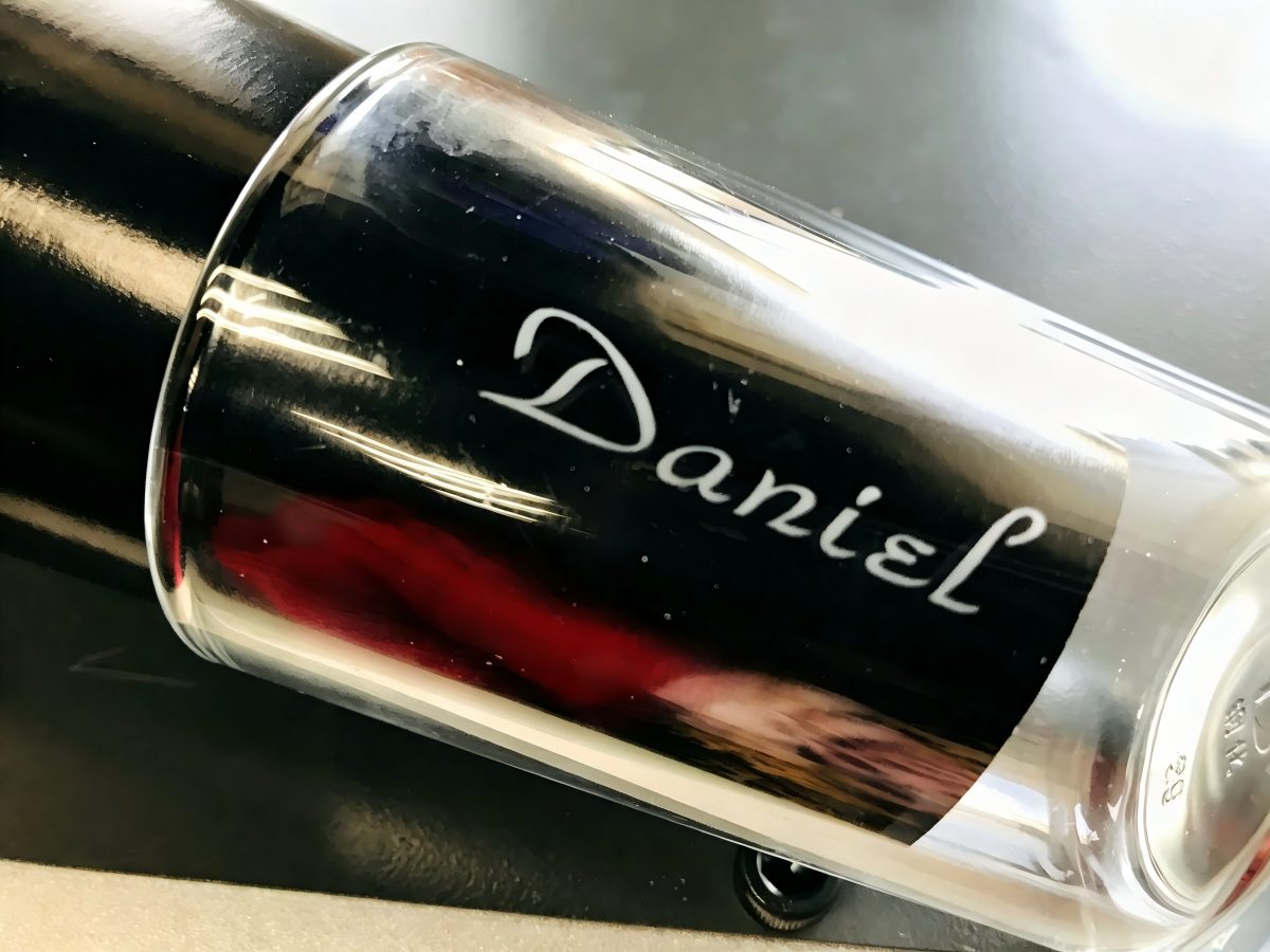 Frosted logo engraved on a glass surface